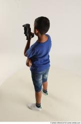 TIMBO STANDING POSE WITH GUN